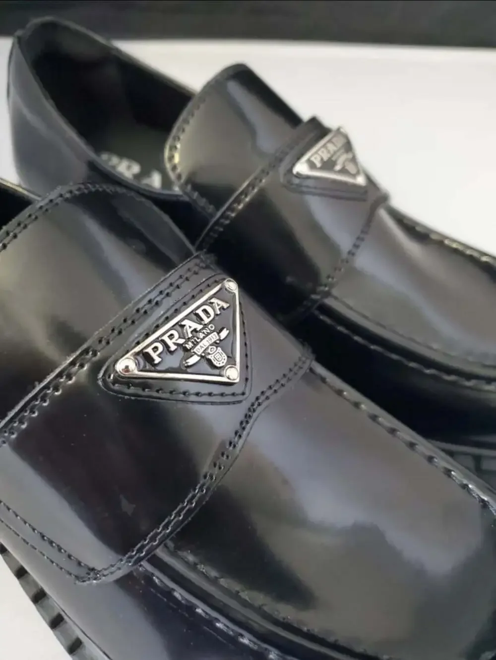 Prada Spazzolato Brushed Leather Loafers with Metal Triangle Logo